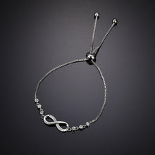 Load image into Gallery viewer, Shining Diva Fashion Latest Stylish Infinity Crystal Charm Silver Plated Bracelet for Women and Girls (10672b) Free Size
