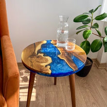 Load image into Gallery viewer, Round Blue River Wooden Coffee Table made with live edge wild olive wood, End Table with Wooden Tapered Legs, Modern Resin Side Table
